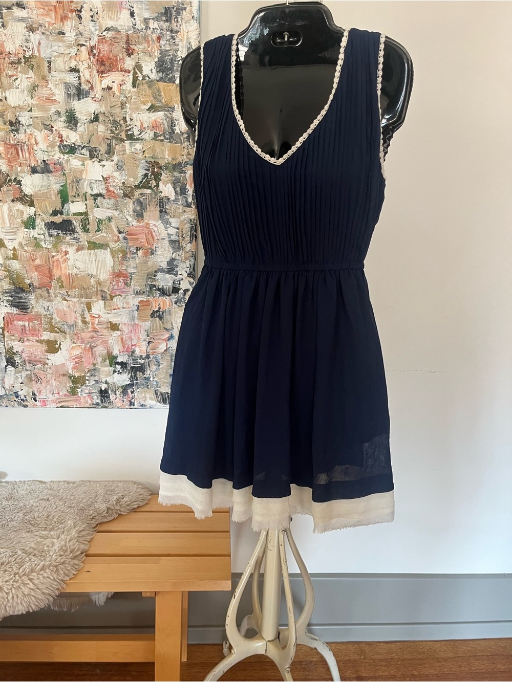 Navy Sleeveless V-Neck Pleated Mini Dress with Cream Hem and Crochet Trim